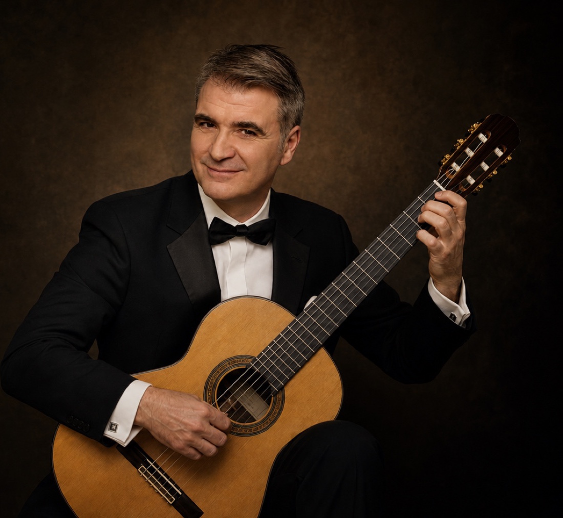 Rafael Serrallet holding a classical guitar