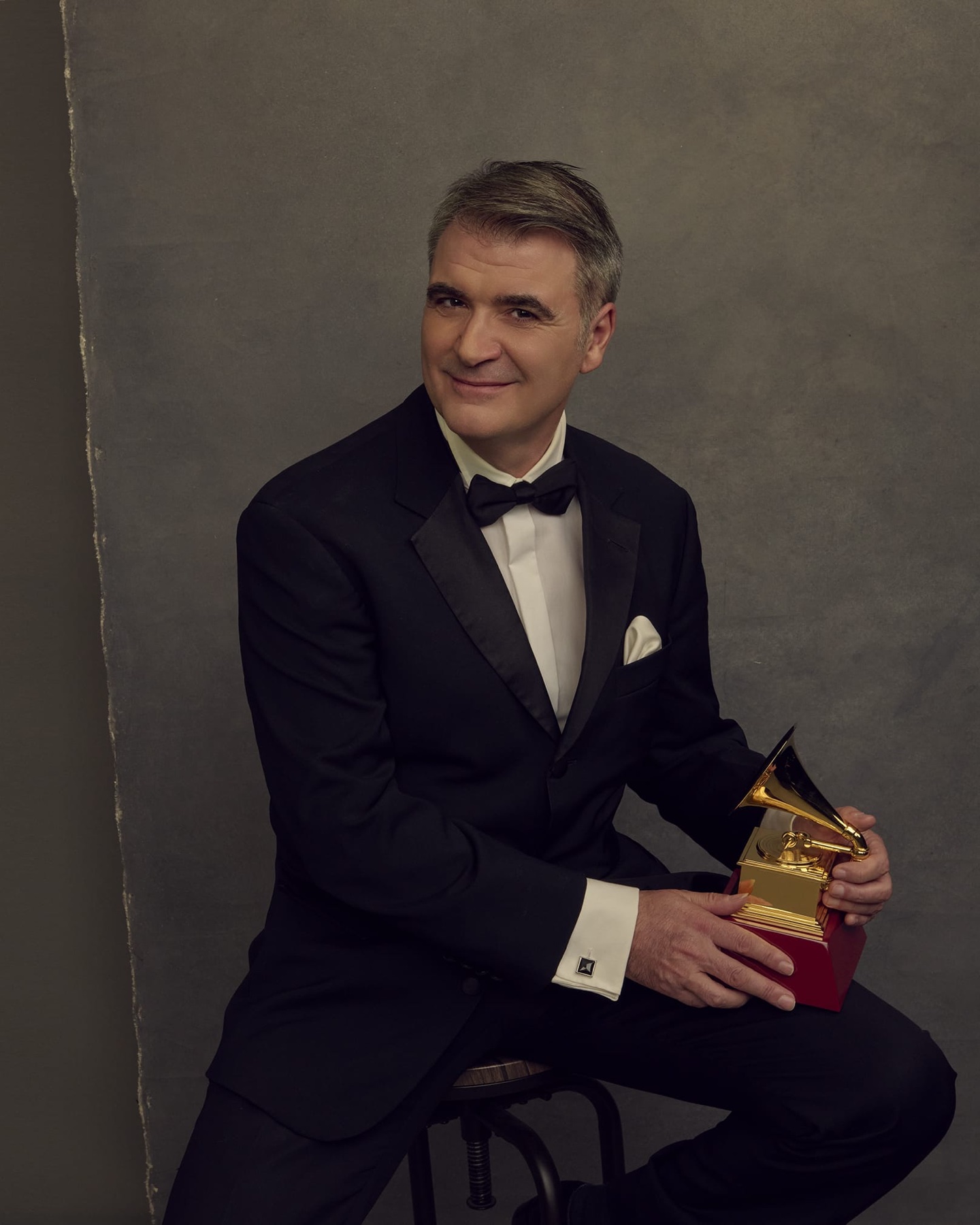 Rafael Serrallet holding a Latin GRAMMY trophy